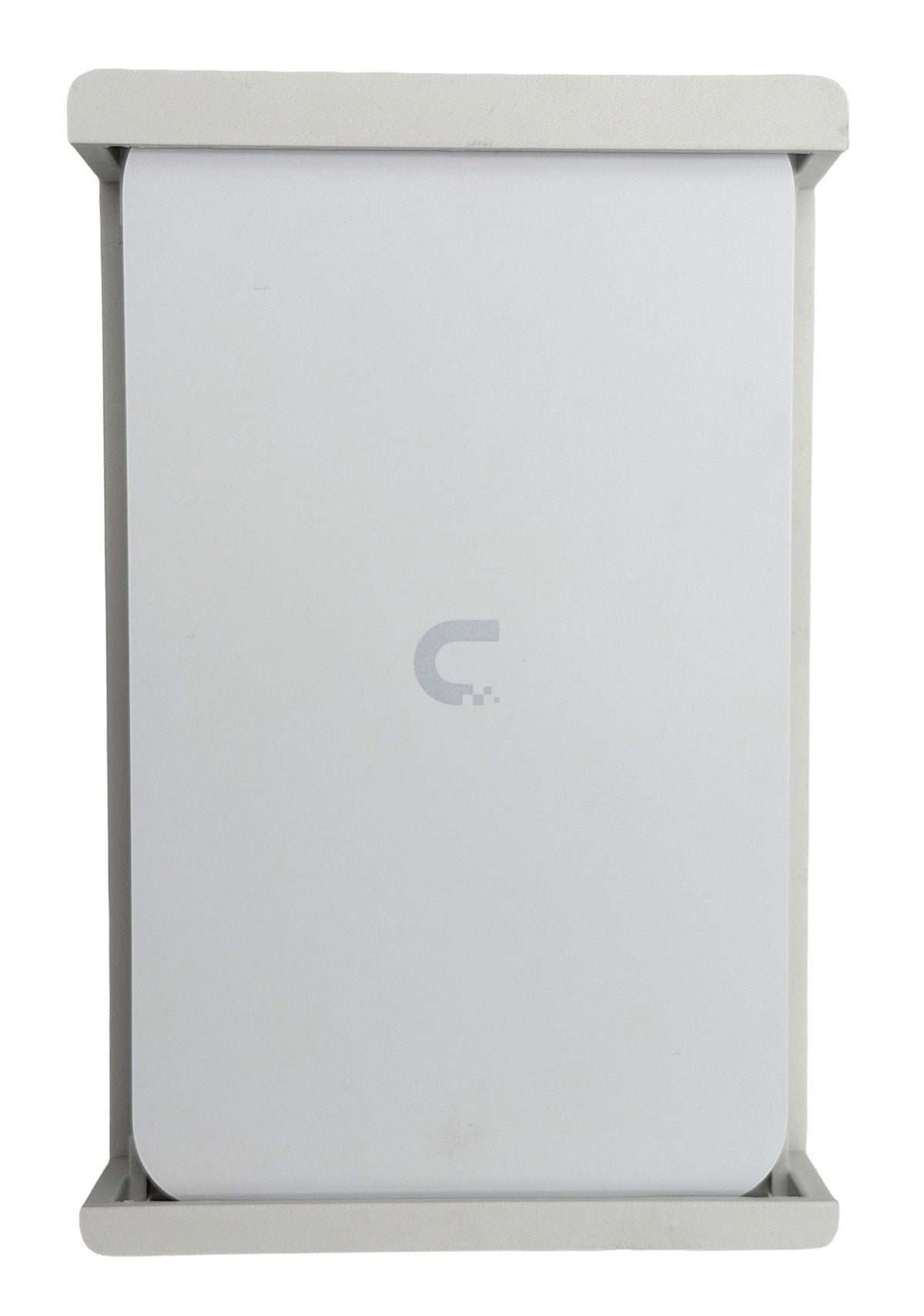 Ubiquiti UCG-Fiber hanging in the white HangLab wall mount, seen from the front