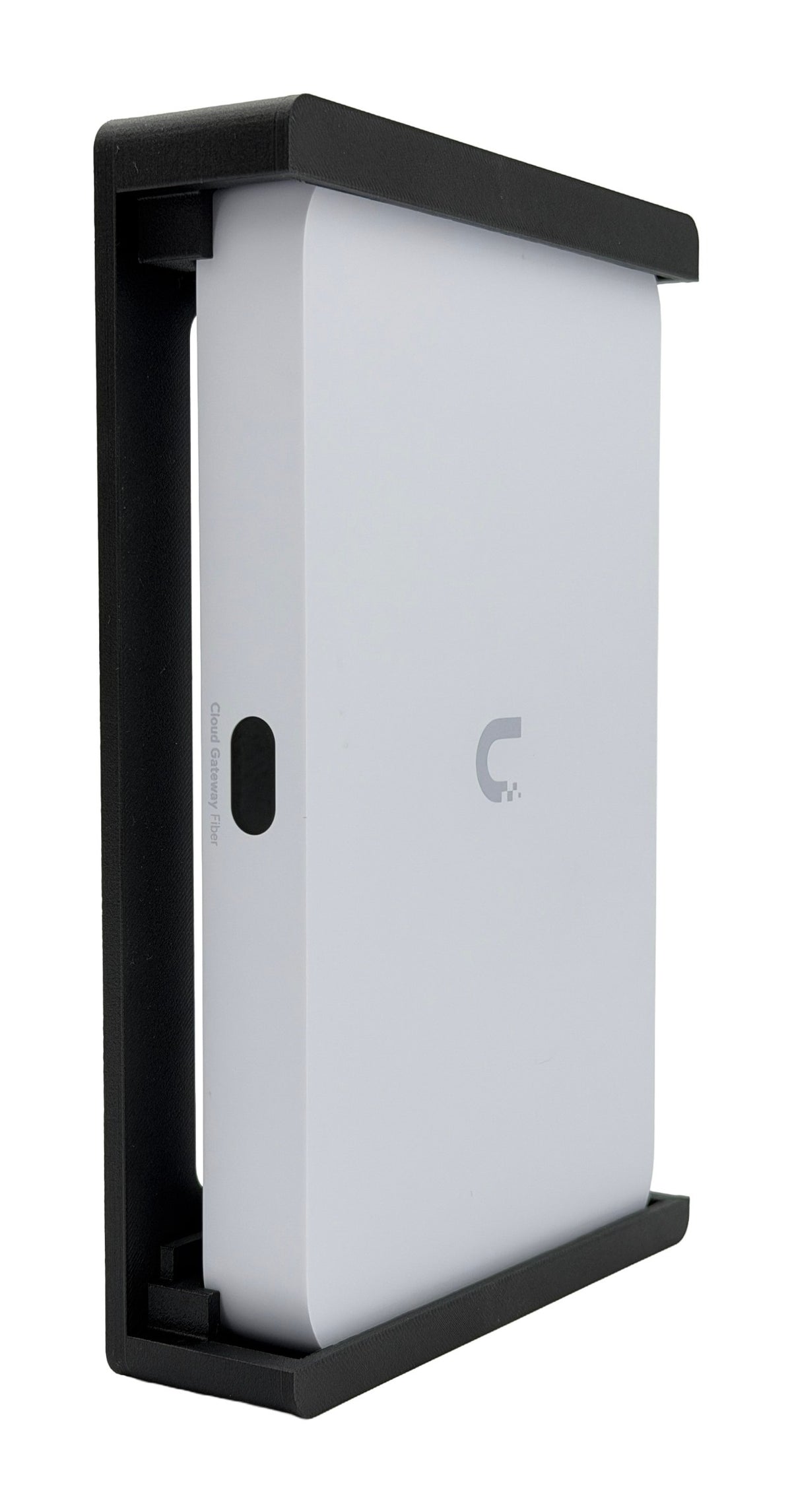 HangLab wall mount for the Ubiquiti UCG-Fiber in black, three-quarter view with the gateway standing in place
